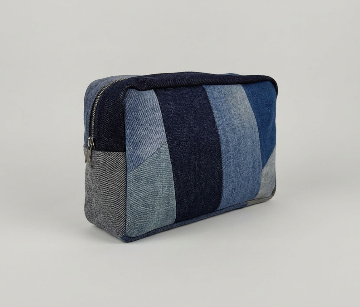 denim striped pouch on a light gray background